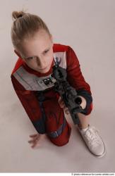 DENISA KNEELING POSE WITH GUN